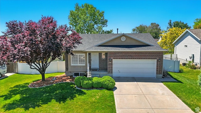 146 S 1125 W, Layton, UT 84041 - view of front facade featuring a garage, a shingled roof, driveway, and brick siding