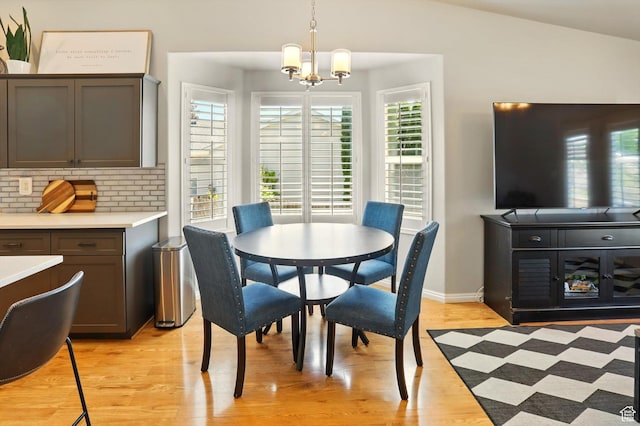146 S 1125 W, Layton, UT 84041 - dining space featuring a chandelier, light wood-style flooring, and baseboards