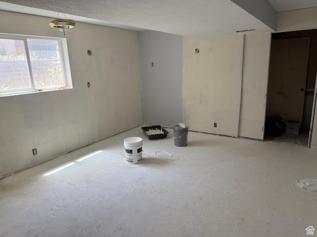 4471 S Honeywood Ln, West Valley City, UT 84120 - unfurnished room with a textured ceiling