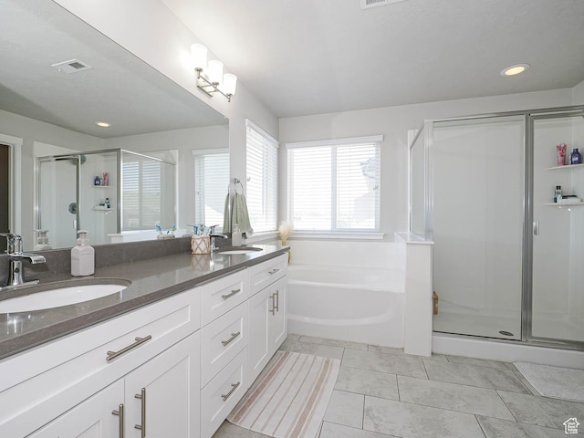 957 W Mckenna Rd, Bluffdale, UT 84065 - bathroom with a shower stall, double vanity, a garden tub, tile patterned flooring, and recessed lighting
