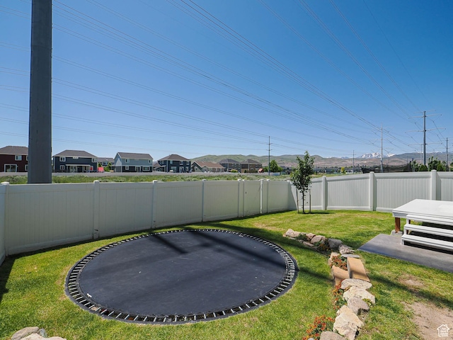 957 W Mckenna Rd, Bluffdale, UT 84065 - view of yard featuring a trampoline and a residential view
