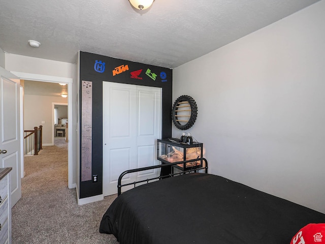 957 W Mckenna Rd, Bluffdale, UT 84065 - bedroom featuring carpet floors, a closet, and a textured ceiling
