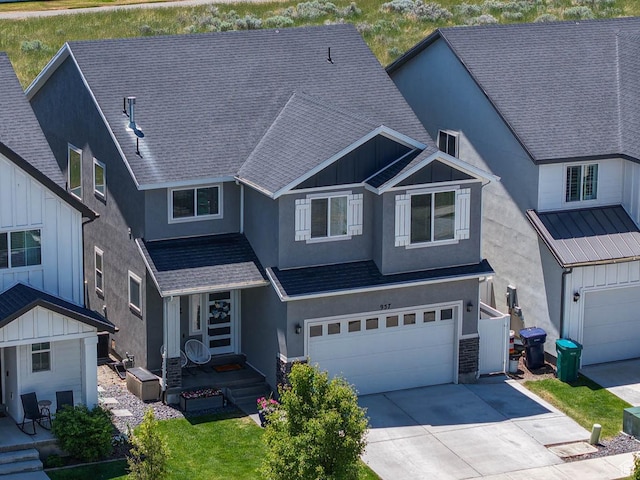 957 W Mckenna Rd, Bluffdale, UT 84065 - view of front facade featuring stucco siding, driveway, an attached garage, and a shingled roof