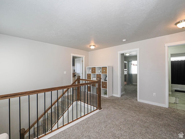 957 W Mckenna Rd, Bluffdale, UT 84065 - corridor with an upstairs landing, carpet flooring, baseboards, and a textured ceiling