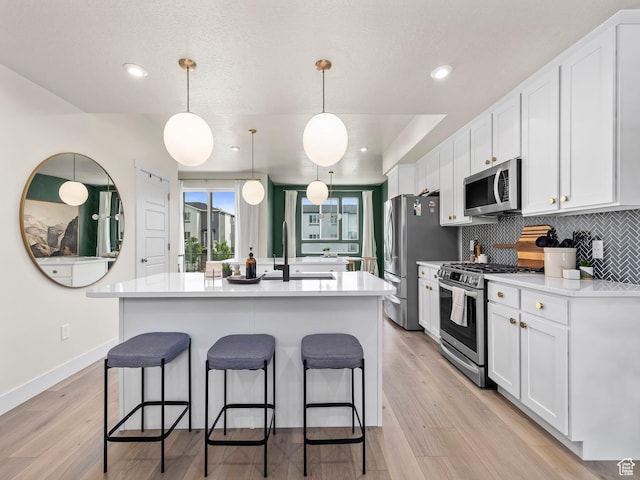 1031 W 360 S, American Fork, UT 84003 - kitchen featuring stainless steel appliances, a sink, white cabinets, and recessed lighting
