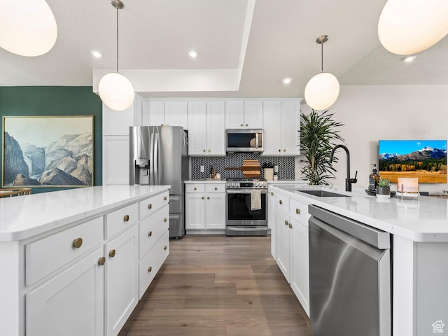 1031 W 360 S, American Fork, UT 84003 - kitchen with appliances with stainless steel finishes, a kitchen island with sink, a sink, tasteful backsplash, and recessed lighting