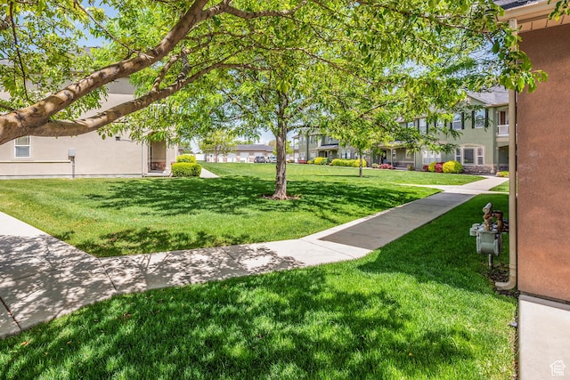 5242 W Cool Water Way S, West Jordan, UT 84081 - view of property's community featuring a yard and a residential view