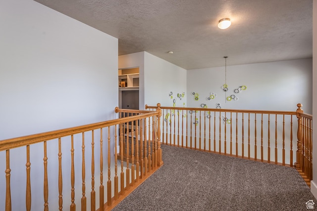 5242 W Cool Water Way S, West Jordan, UT 84081 - hall with carpet, a textured ceiling, and an upstairs landing
