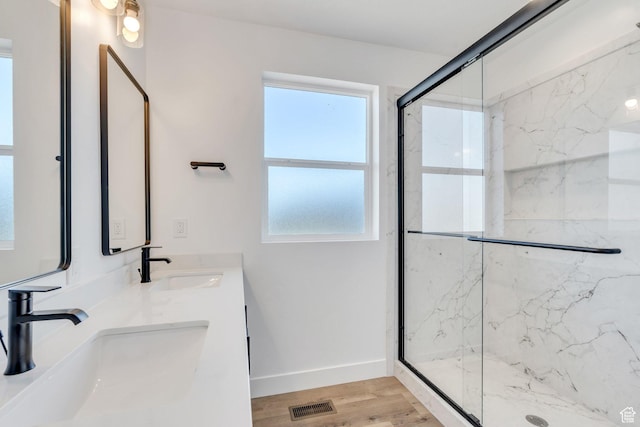 515 N 600 E, Spanish Fork, UT 84660 - bathroom with a marble finish shower, double vanity, healthy amount of natural light, and wood finished floors