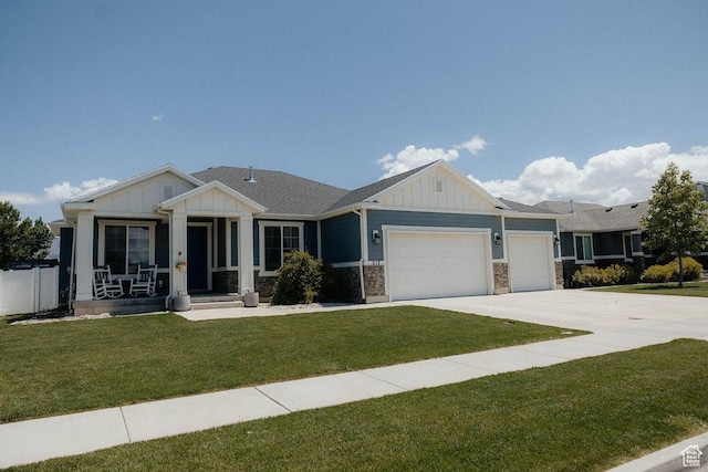 217 S 1230 W Unit 15, Spanish Fork, UT 84660 - view of front of property featuring board and batten siding, an attached garage, driveway, and a front lawn