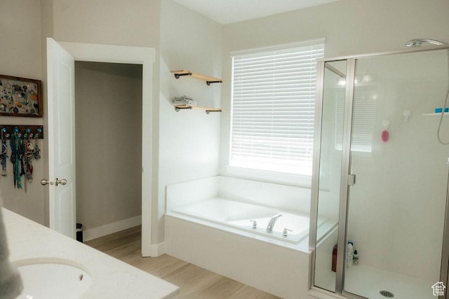 217 S 1230 W Unit 15, Spanish Fork, UT 84660 - bathroom with wood finished floors, a shower stall, a bath, and vanity