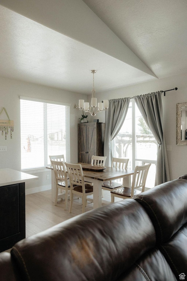 217 S 1230 W Unit 15, Spanish Fork, UT 84660 - dining area with a chandelier, light wood finished floors, and baseboards