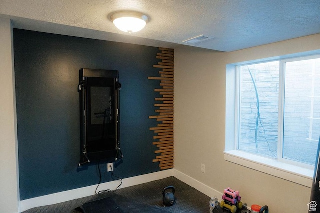217 S 1230 W Unit 15, Spanish Fork, UT 84660 - exercise area featuring baseboards and a textured ceiling