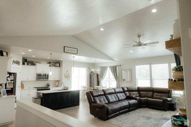 217 S 1230 W Unit 15, Spanish Fork, UT 84660 - living room with vaulted ceiling, a ceiling fan, light wood-style flooring, a chandelier, and recessed lighting