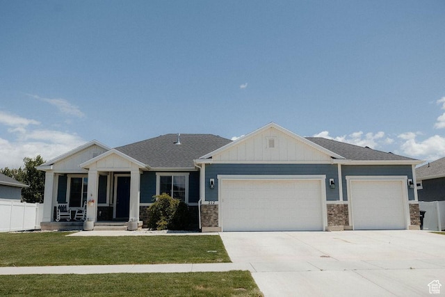 217 S 1230 W Unit 15, Spanish Fork, UT 84660 - view of front of house with a garage, board and batten siding, and concrete driveway