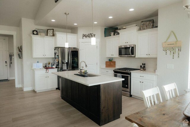 217 S 1230 W Unit 15, Spanish Fork, UT 84660 - kitchen featuring appliances with stainless steel finishes, a sink, white cabinets, recessed lighting, and light countertops