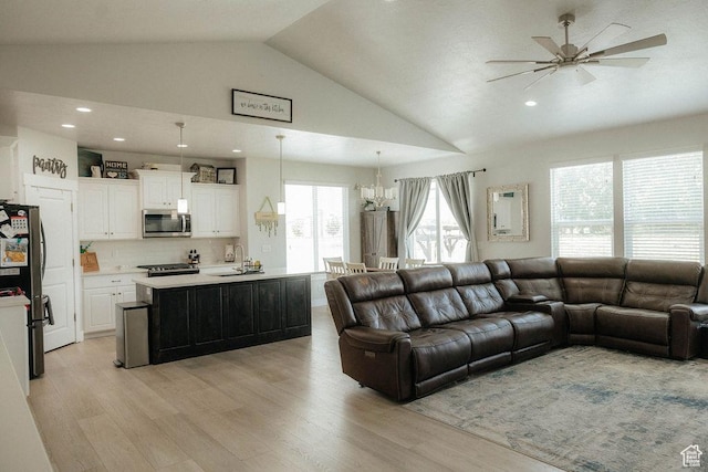 217 S 1230 W Unit 15, Spanish Fork, UT 84660 - living room featuring vaulted ceiling, light wood-style floors, a ceiling fan, a chandelier, and recessed lighting