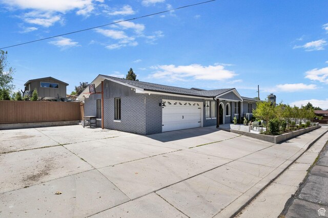 177 S Canyon Ave, Springville, UT 84663 - single story home with concrete driveway, brick siding, and an attached garage