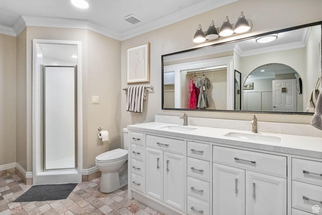 177 S Canyon Ave, Springville, UT 84663 - bathroom featuring double vanity, toilet, a shower stall, baseboards, and a walk in closet