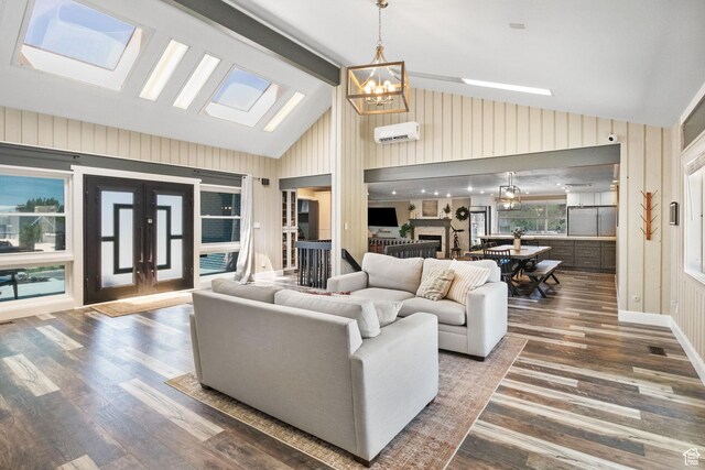 177 S Canyon Ave, Springville, UT 84663 - living area with a chandelier, lofted ceiling, a wall mounted air conditioner, wood finished floors, and wood walls