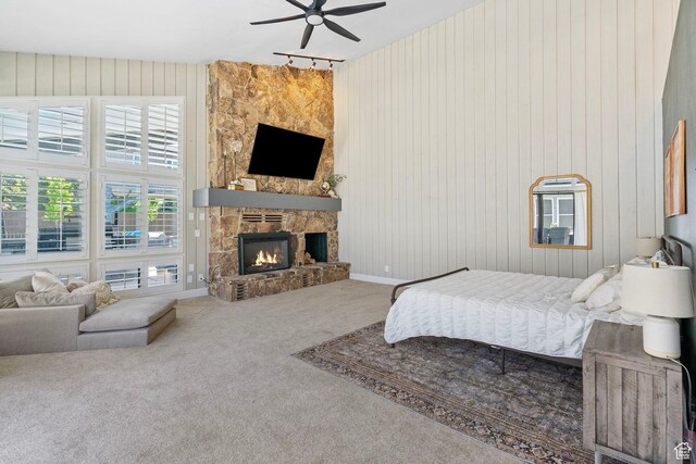 177 S Canyon Ave, Springville, UT 84663 - carpeted bedroom featuring a fireplace, wood walls, and baseboards