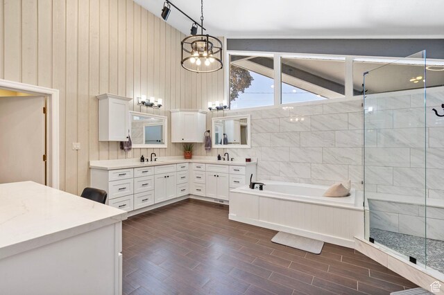 177 S Canyon Ave, Springville, UT 84663 - full bath with double vanity, a bath, a stall shower, a chandelier, and wood finished floors