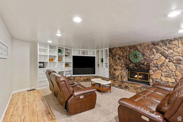 177 S Canyon Ave, Springville, UT 84663 - living room featuring wood finished floors, baseboards, recessed lighting, and a stone fireplace