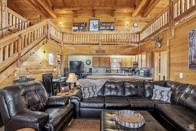 9911 S Antelope Xing, Duchesne, UT 84021 - living room with wood walls, wooden ceiling with exposed beams, a high ceiling, and tile patterned floors
