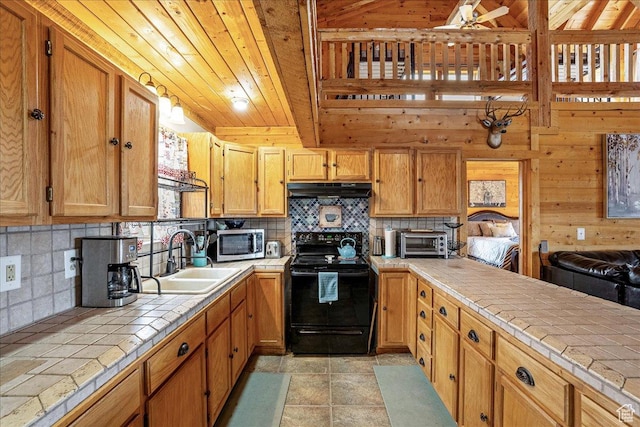 9911 S Antelope Xing, Duchesne, UT 84021 - kitchen with tile countertops, black range with electric cooktop, a sink, stainless steel microwave, and under cabinet range hood