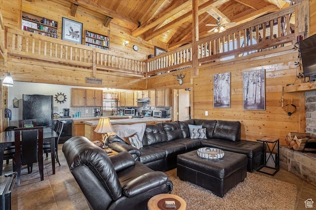 9911 S Antelope Xing, Duchesne, UT 84021 - living room with a ceiling fan, high vaulted ceiling, wooden ceiling with exposed beams, and wood walls