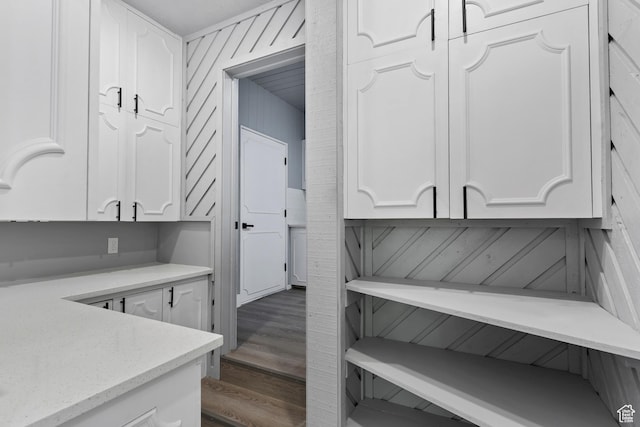 4203 S College Dr E, Ogden, UT 84403 - kitchen with white cabinetry, wood finished floors, and light stone counters