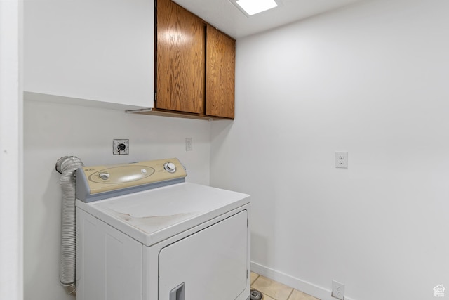 4203 S College Dr E, Ogden, UT 84403 - laundry area featuring washer / clothes dryer, cabinet space, baseboards, and light tile patterned floors