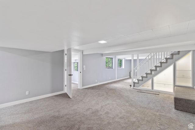 4203 S College Dr E, Ogden, UT 84403 - basement with stairs, baseboards, and carpet flooring