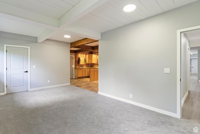 4203 S College Dr E, Ogden, UT 84403 - unfurnished living room featuring beamed ceiling, baseboards, light colored carpet, a sink, and recessed lighting