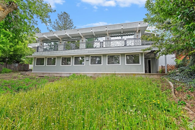 4203 S College Dr E, Ogden, UT 84403 - rear view of house featuring a balcony