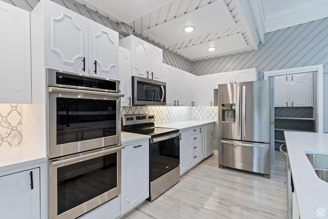 4203 S College Dr E, Ogden, UT 84403 - kitchen with appliances with stainless steel finishes, light countertops, and decorative backsplash