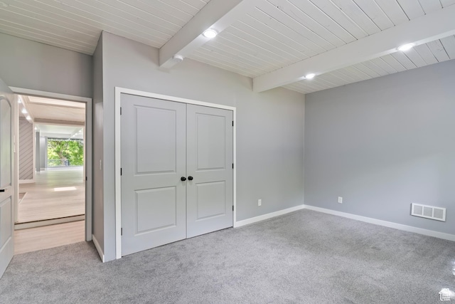 4203 S College Dr E, Ogden, UT 84403 - unfurnished bedroom featuring carpet flooring, a closet, baseboards, and wooden ceiling with exposed beams