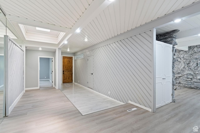 4203 S College Dr E, Ogden, UT 84403 - unfurnished room with baseboards, light wood-style floors, and beamed ceiling