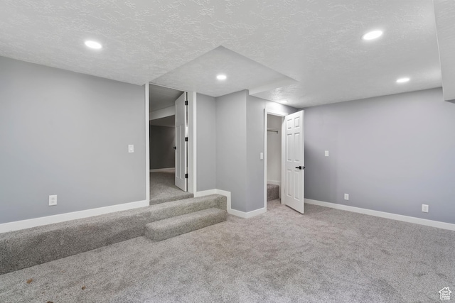 4203 S College Dr E, Ogden, UT 84403 - finished basement with carpet, recessed lighting, baseboards, and a textured ceiling
