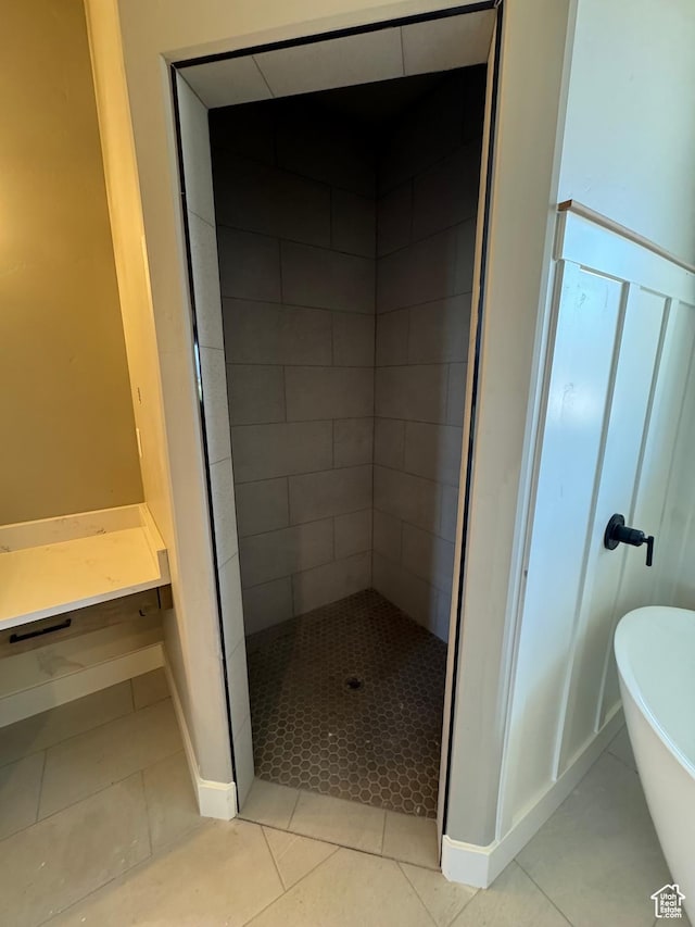 1234 N 4950 W, Plain City, UT 84404 - full bathroom featuring tile patterned flooring, a freestanding bath, a tile shower, and baseboards
