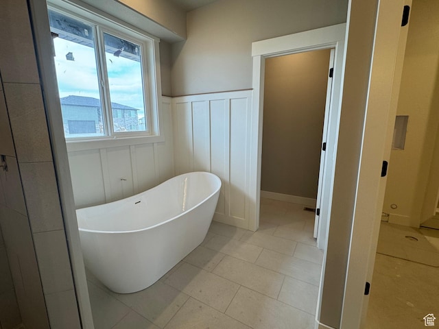 1234 N 4950 W, Plain City, UT 84404 - bathroom with a soaking tub, wainscoting, and a decorative wall
