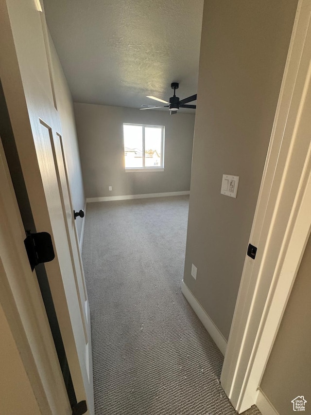 1234 N 4950 W, Plain City, UT 84404 - spare room featuring a textured ceiling, baseboards, ceiling fan, and carpet flooring
