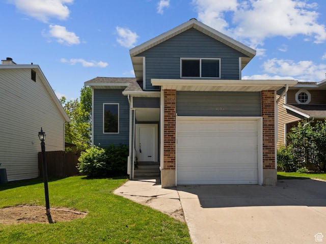 3095 W 8525 S, West Jordan, UT 84088 - view of front of house featuring concrete driveway, brick siding, and an attached garage