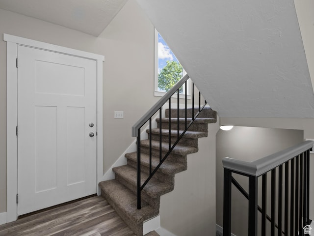 3095 W 8525 S, West Jordan, UT 84088 - stairway featuring wood finished floors, baseboards, and lofted ceiling
