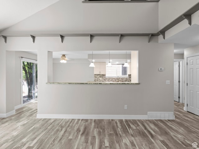 3095 W 8525 S, West Jordan, UT 84088 - unfurnished living room with wood finished floors, baseboards, and ceiling fan