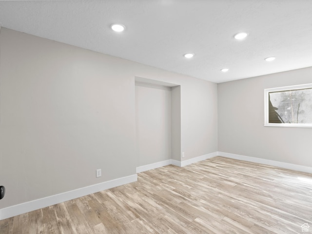 3095 W 8525 S, West Jordan, UT 84088 - empty room with light wood finished floors, baseboards, and recessed lighting