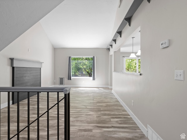 3095 W 8525 S, West Jordan, UT 84088 - hallway featuring baseboards, wood finished floors, plenty of natural light, and lofted ceiling