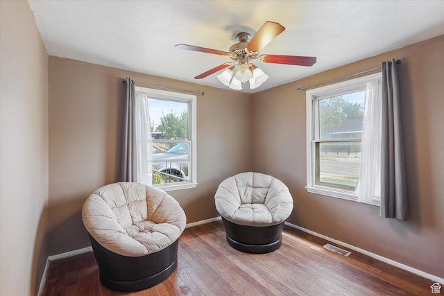 80 S 400 E, Clearfield, UT 84015 - living area with healthy amount of natural light, baseboards, hardwood / wood-style flooring, and a ceiling fan