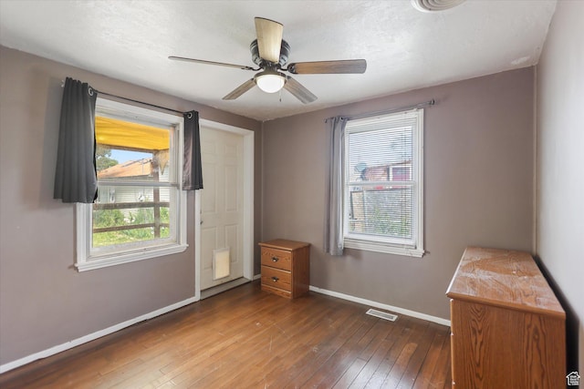 80 S 400 E, Clearfield, UT 84015 - unfurnished bedroom with baseboards, hardwood / wood-style flooring, and ceiling fan