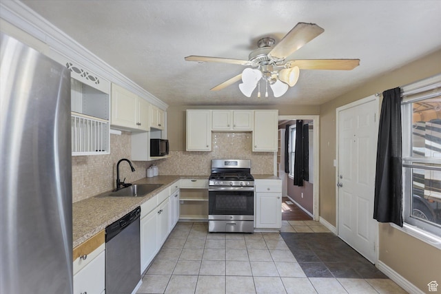 80 S 400 E, Clearfield, UT 84015 - kitchen featuring appliances with stainless steel finishes, a sink, tasteful backsplash, and white cabinets